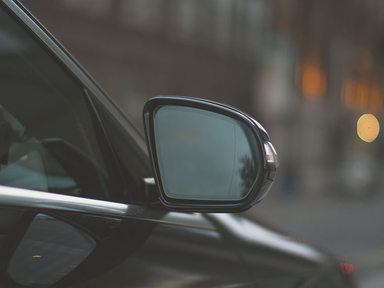 a cars' side mirror in London provided by Addison Lee