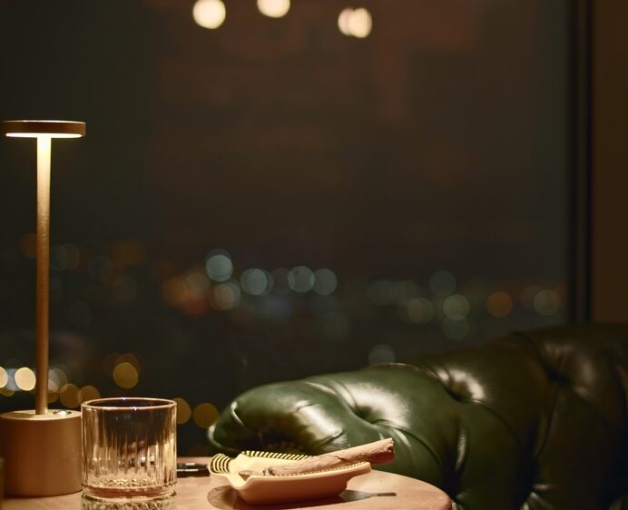 Smoking,Cigar,On,Table,In,Restaurant.,Media.,Close-up,Of,Smoking