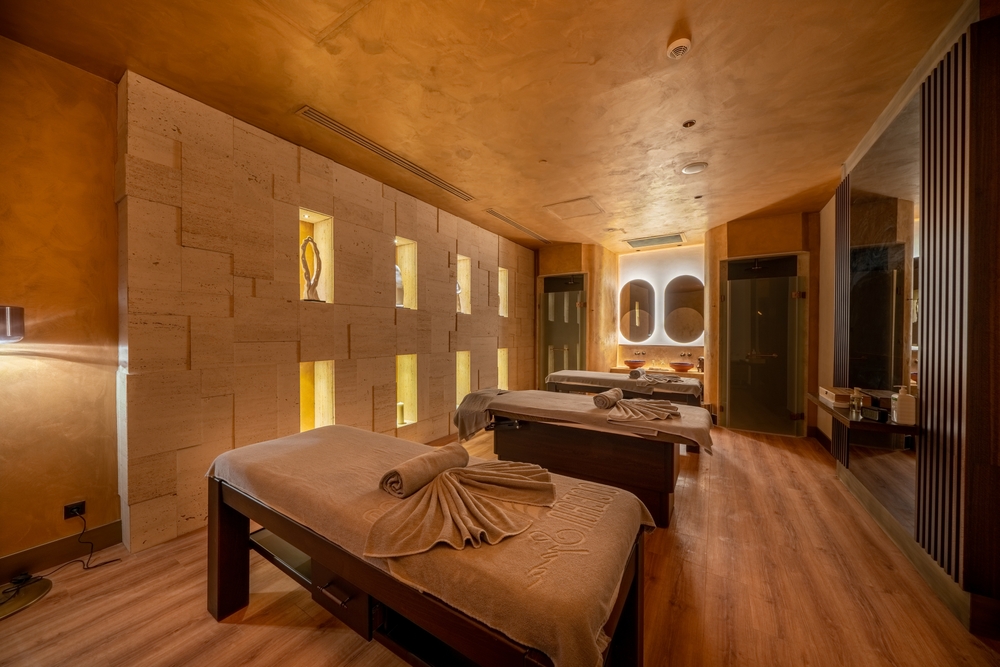 Candle lit spa centre with marble walls and a tranquil feel