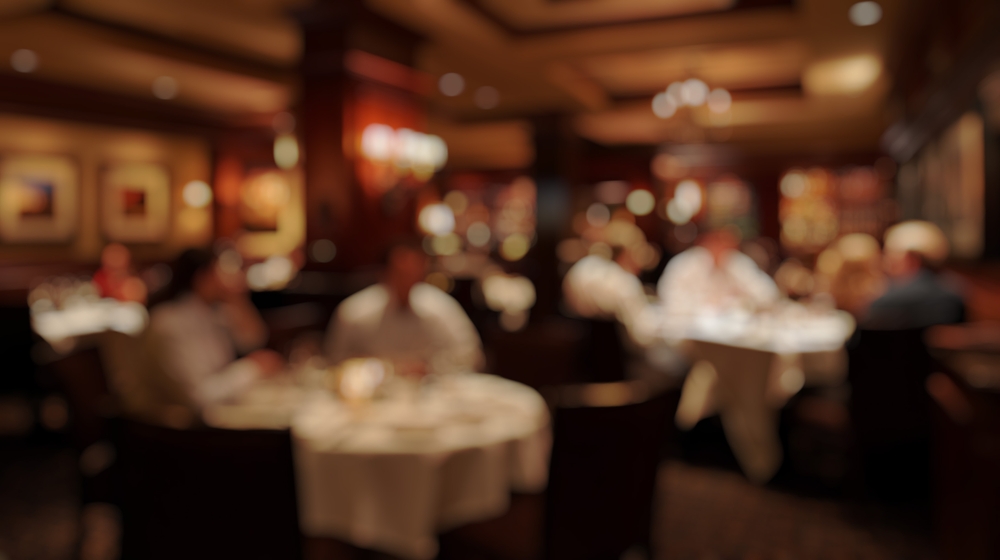 Defocused Background of Elegant Dining Experience in Upscale Restaurant with Soft Lighting