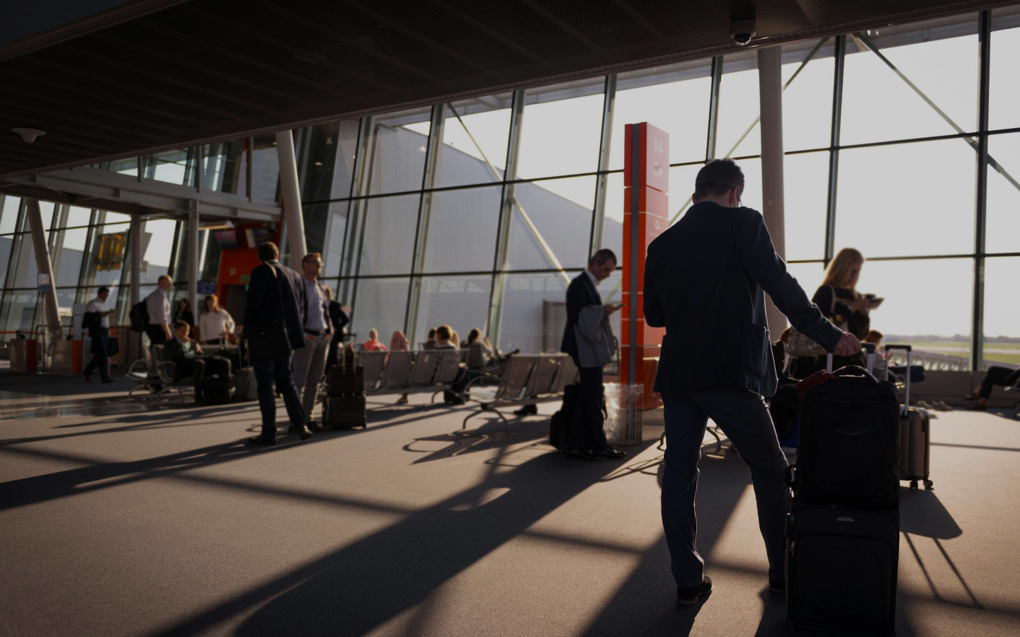 business people waiting in airport terminal
