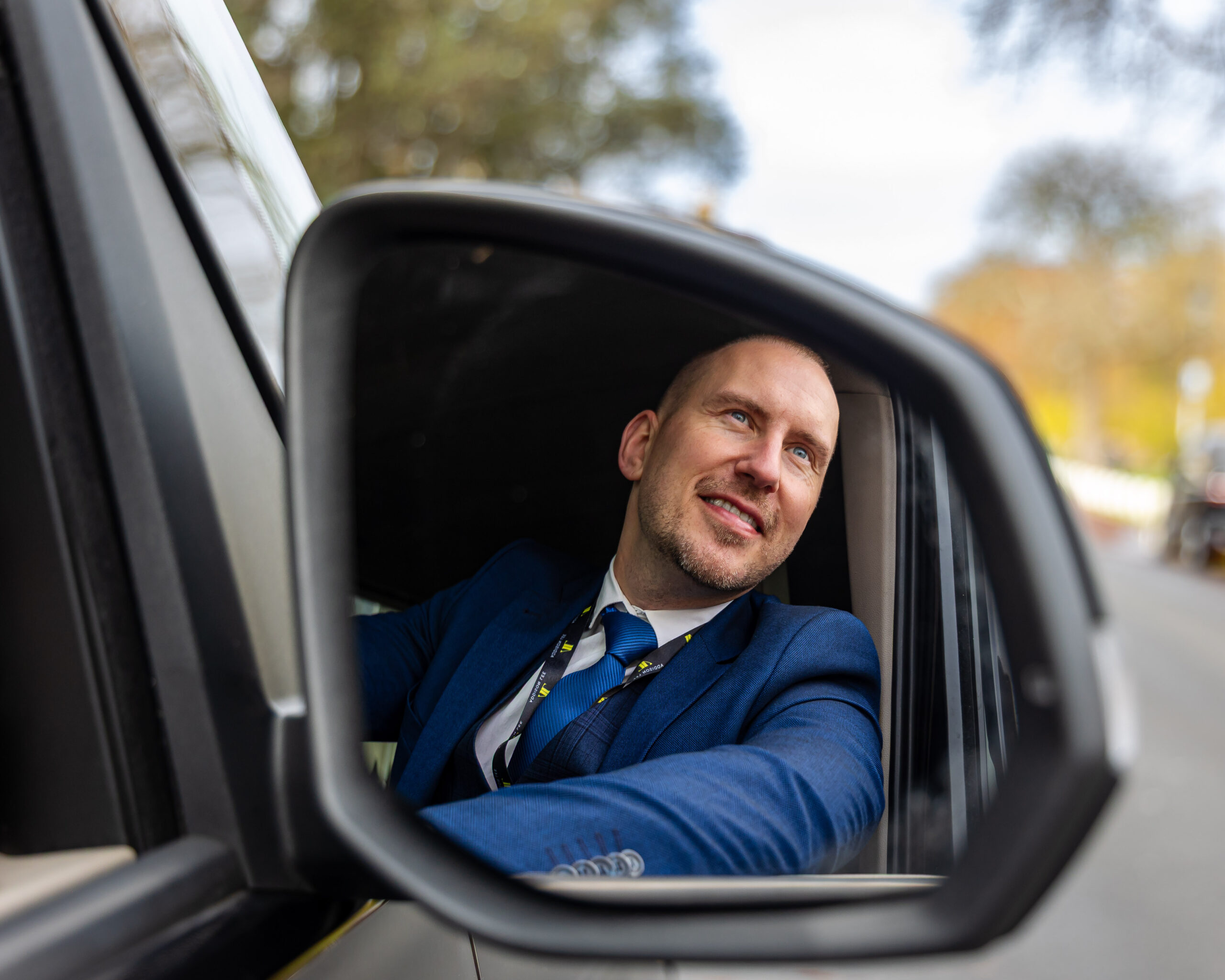 Addison Lee Driver seen through wing mirror