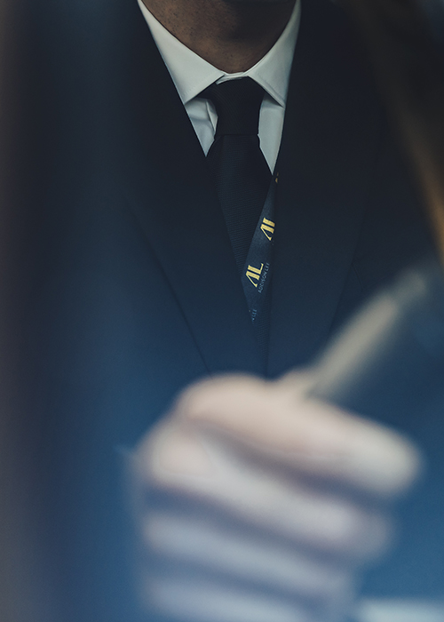 Cropped shot of an Addison Lee driver in his suit