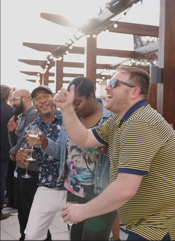 Addison Lee staff members enjoying a rooftop party