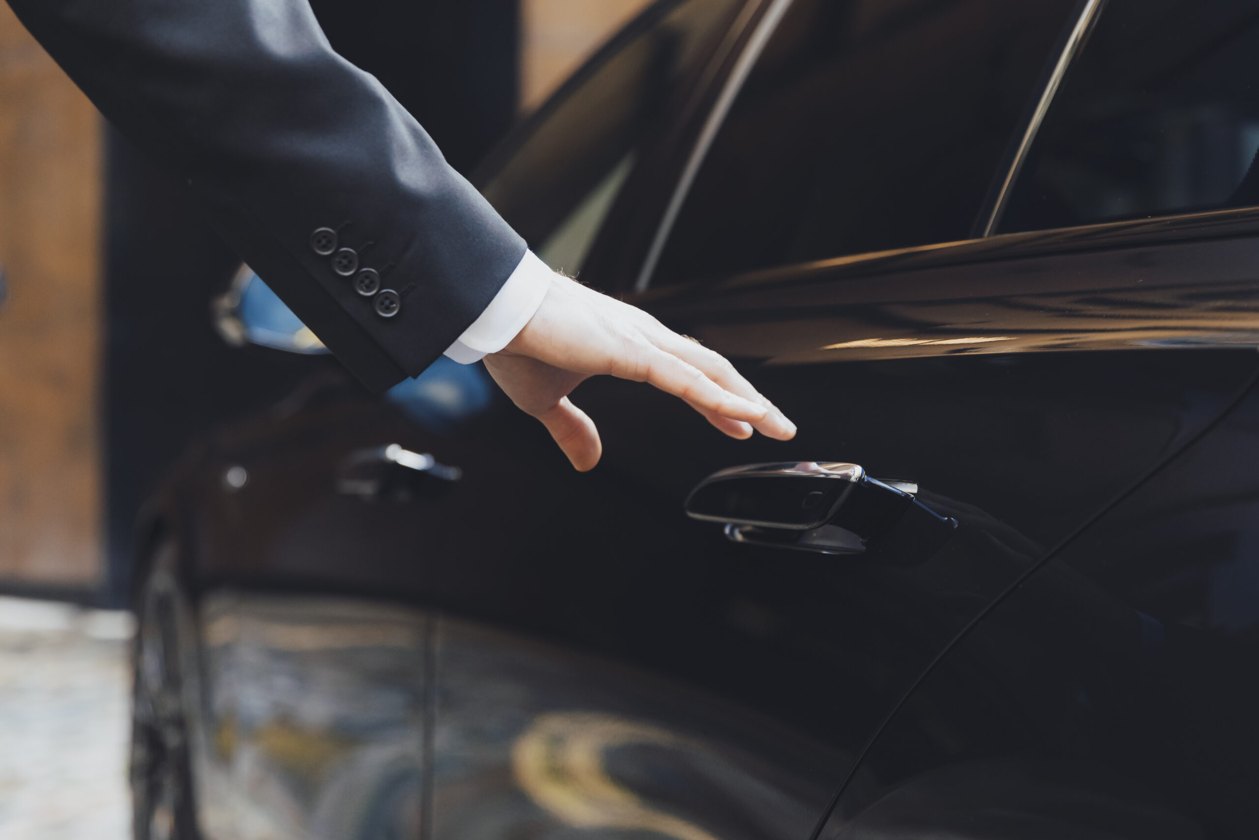 addison lee executive car with driver hand