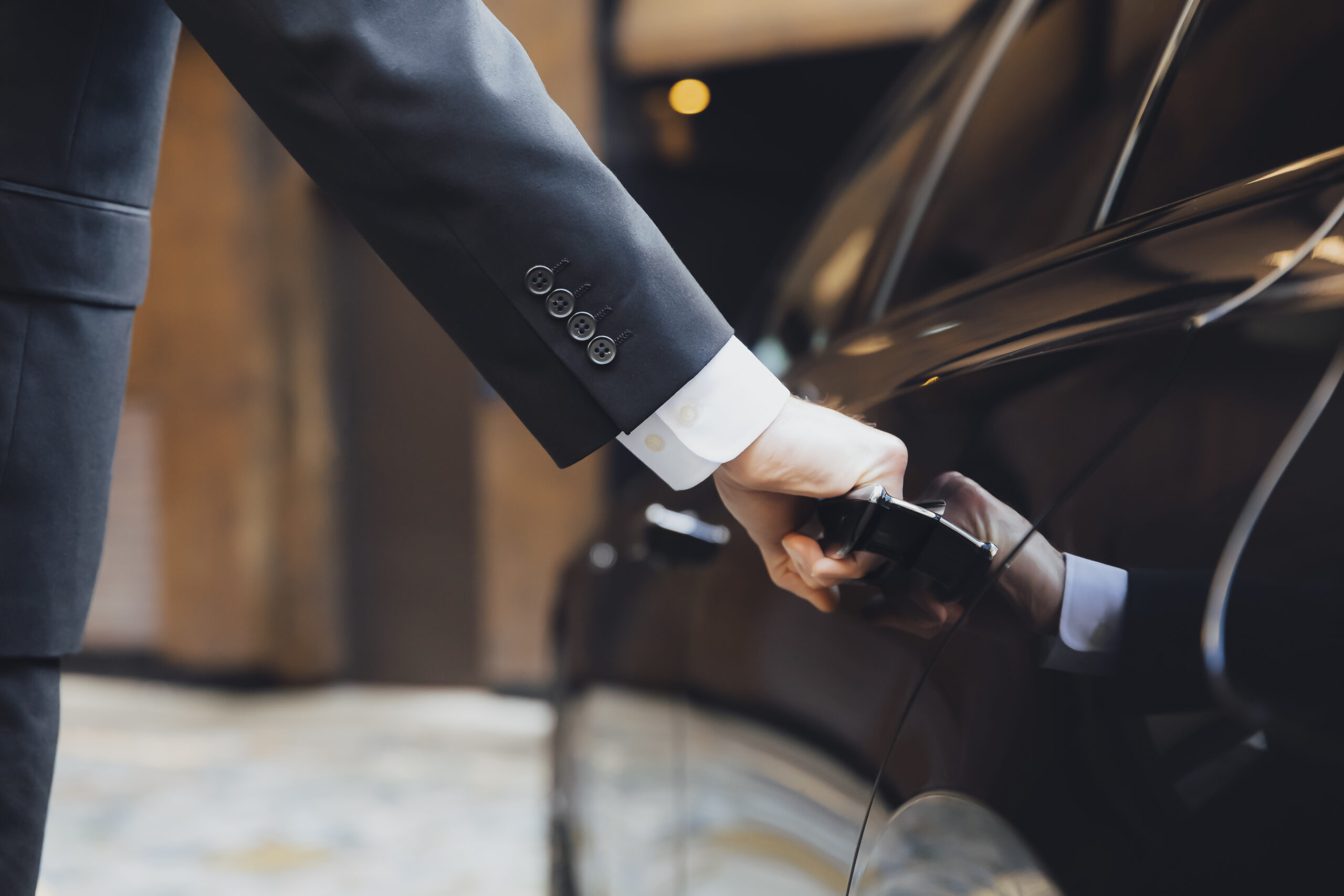 addison lee executive car with driver hand