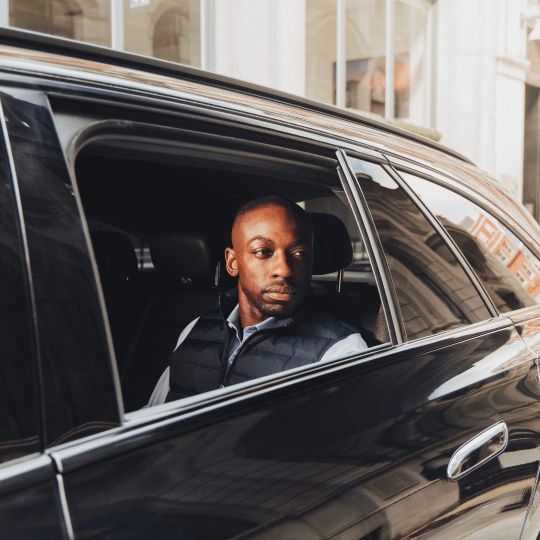 businessman looking out from the exec cars