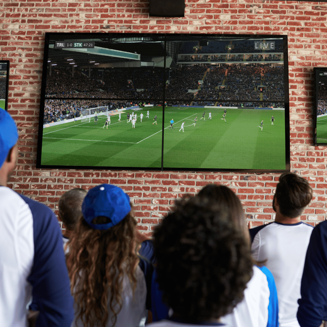 football shown indoor with fans in front