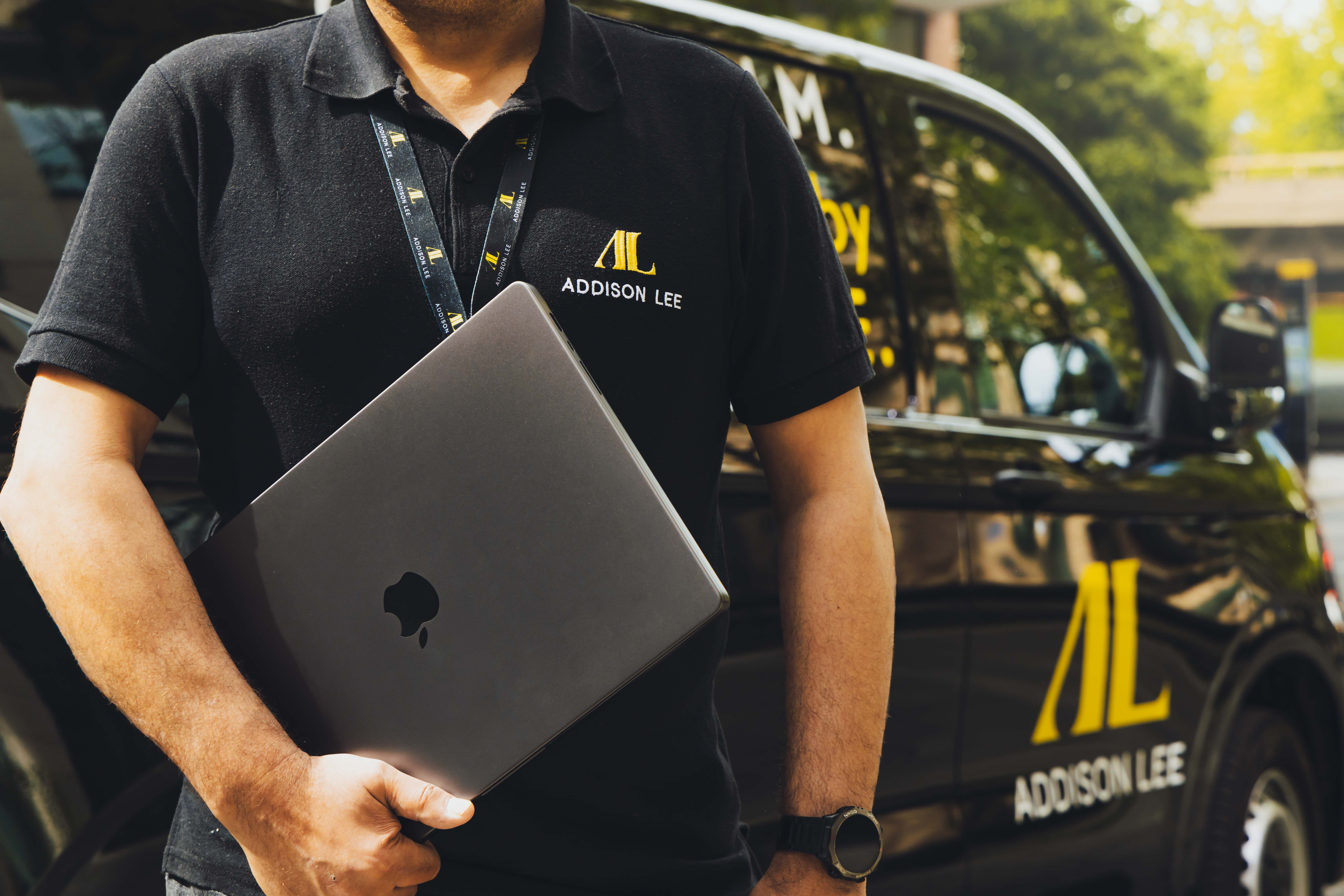 Courier driver delivering a laptop