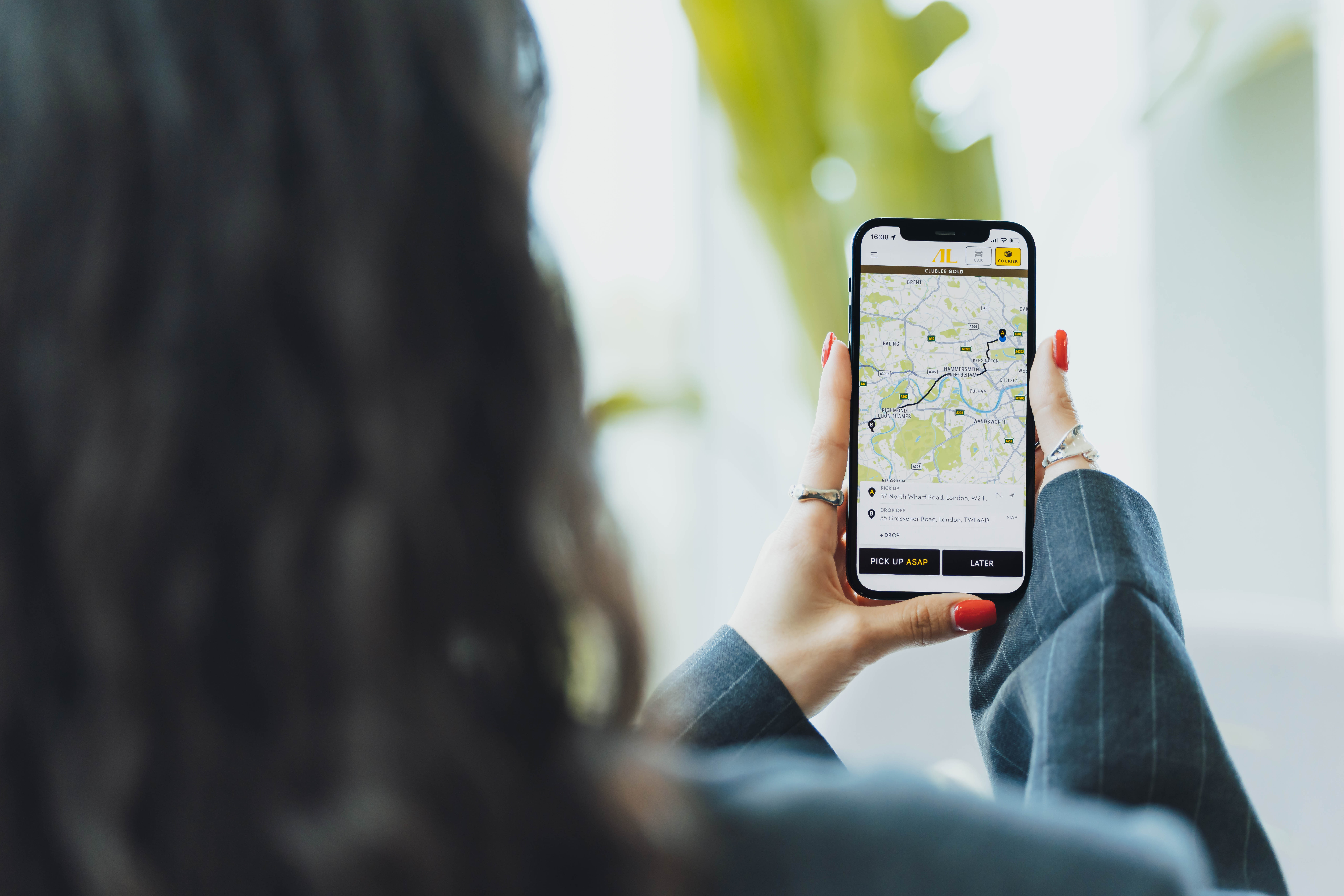 A courier booking showing the Addison Lee app delivering a package to someone across London