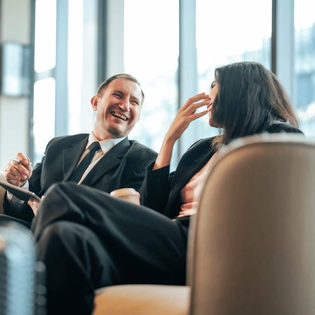 two business people in an airport lounge