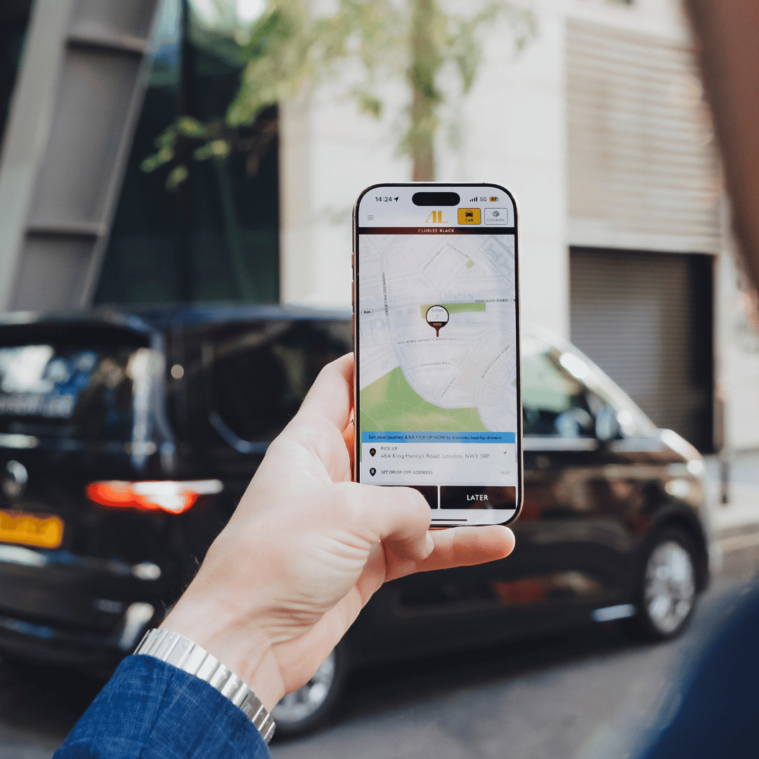 business man holding phone with addison lee app. 1080 x 1080