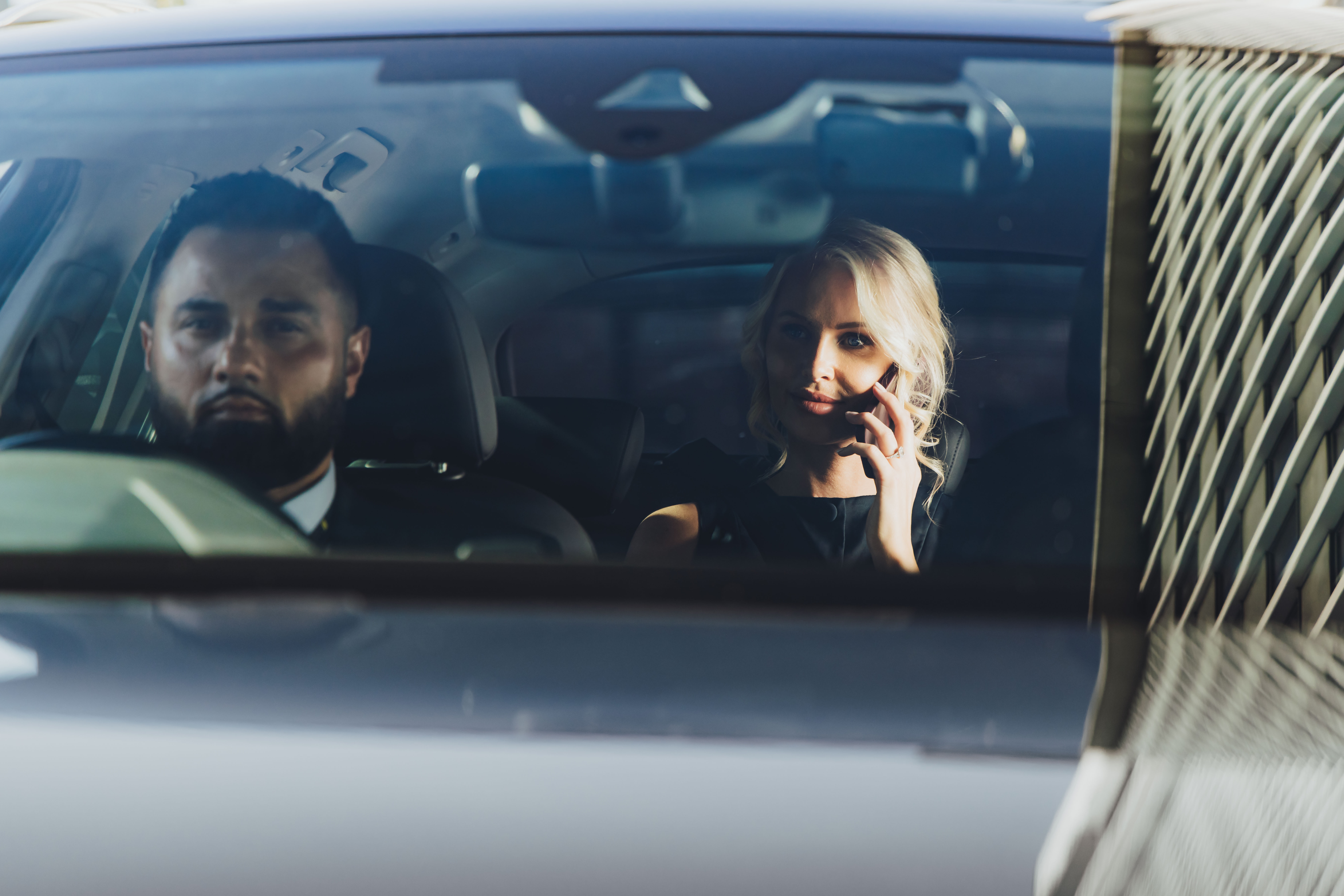 Corporate London woman on the phone in an executive Addison Lee car