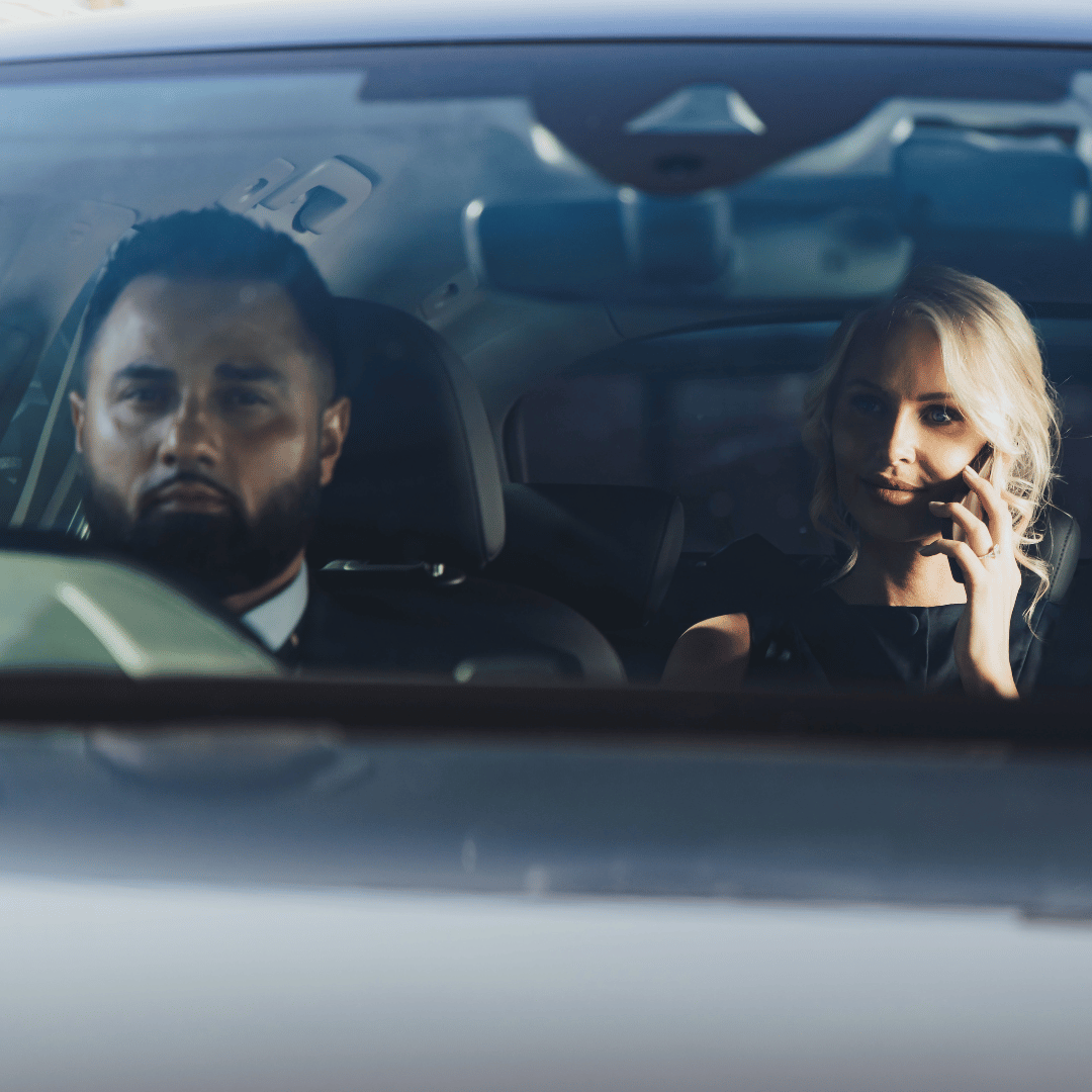Businesswoman in a back of executive car